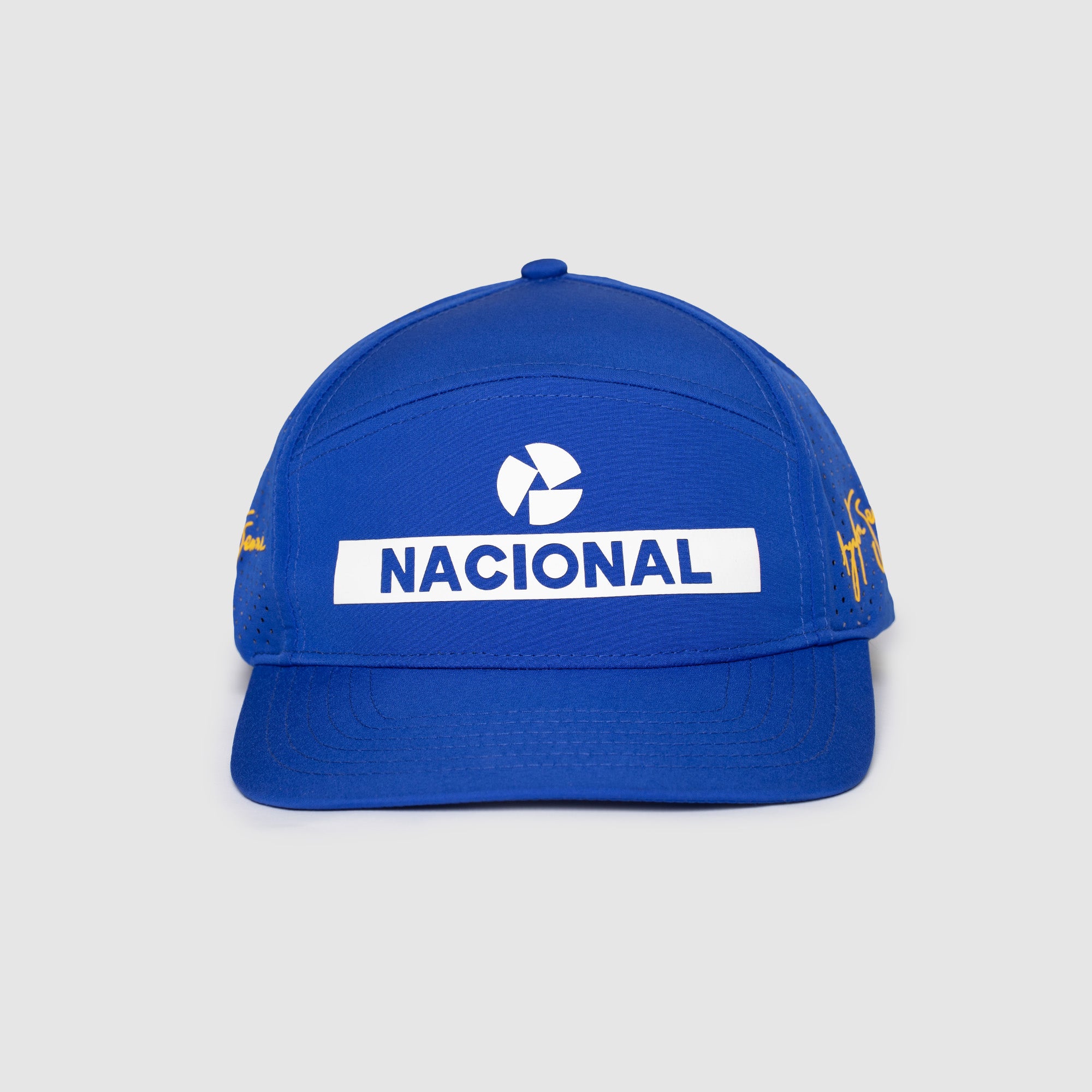 Blue cap with 'Nacional' performance styled 5 panel with logo on a gray background