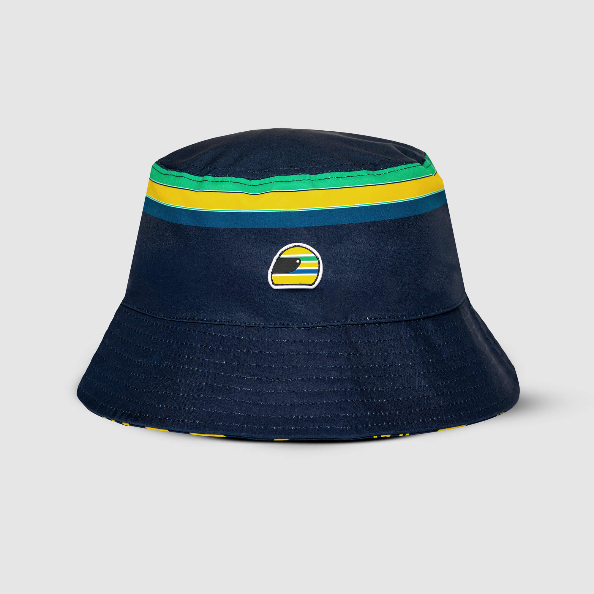 Navy Senna bucket hat with iconic helmet and colorful stripes on a light gray background