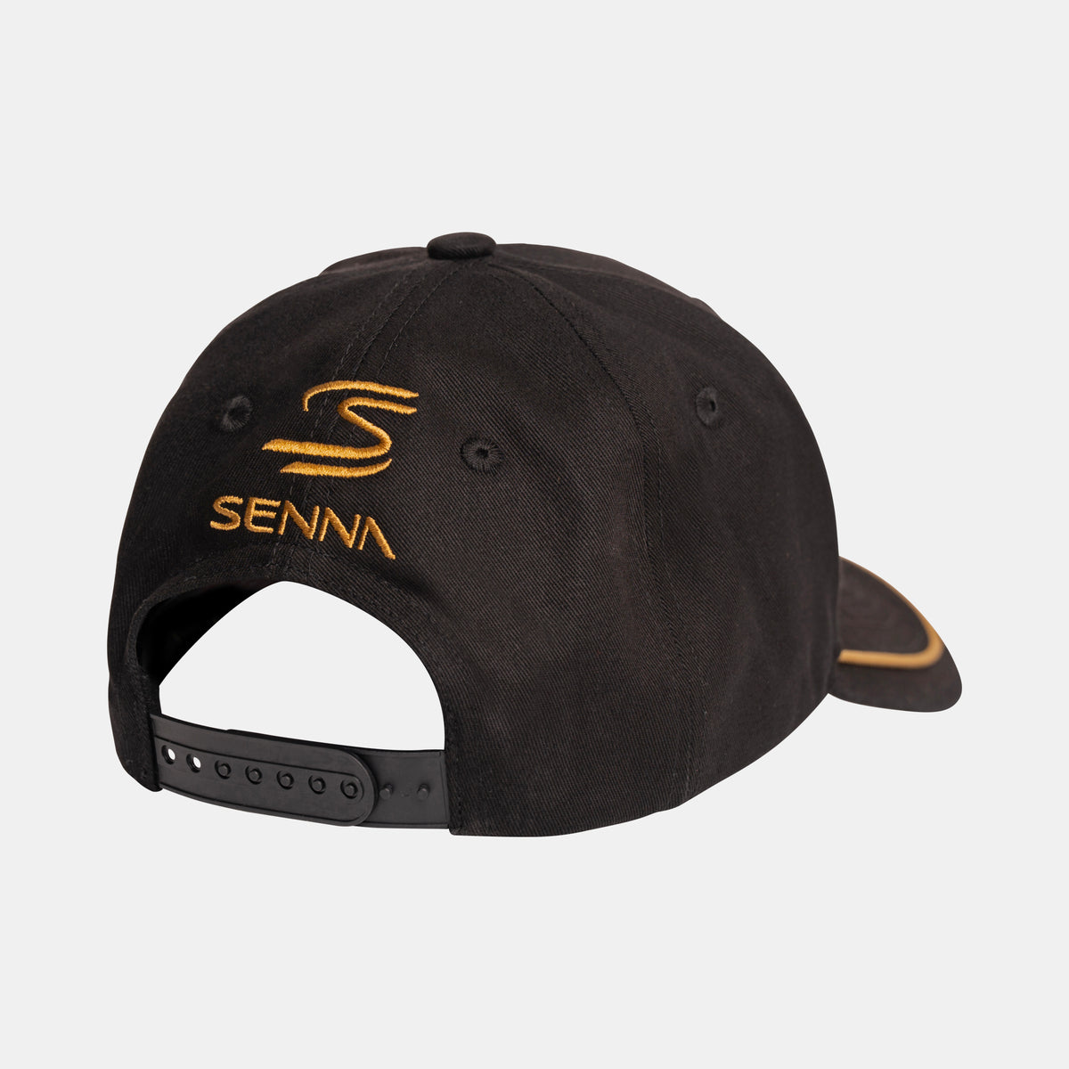 Black Team Lotus and Senna race cap with gold embroidered Senna logo and text on the back, shown from a rear three-quarter angle on a light gray background.